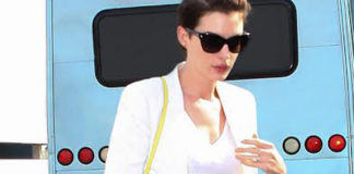 Anne Hathaway borsa A4 Papier Balenciaga borsa Bright Diamante Gucci calzoni Piamita occhiali Christian Dior